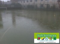 Waterlogged All Weather Pitch needing rejuvenation maintenance Waterlogged All Weather Pitch needing rejuvenation maintenances